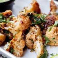 10 Piece Cauliflower Bites · 10 crispy bites of cauliflower fried to perfection and tossed in your choice of sauce. Serve...