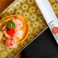 Sashimi Nachos · Five crisp wontons generously topped with sashimi tuna, cilantro, jalapeno, avocado, roe and...