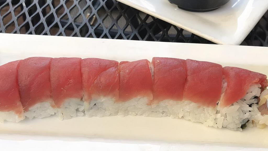 Ichiban Maki · Yellowtail, salmon and avocado, topped with tuna.