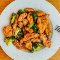 Sesame Chicken · Tender chicken breaded and deep-fried, sautéed with broccoli and garlic in a sweet-savory se...