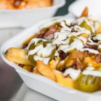 Disco Fries · Cheese gravy crumbled bacon, jalapeños, ranch.