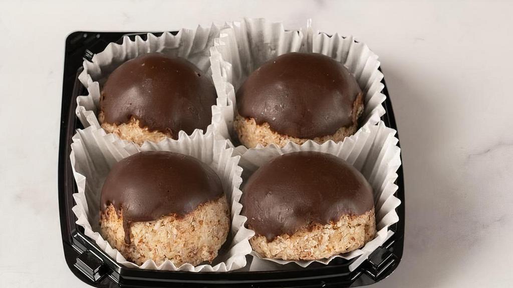 Raw Chocolate-Truffle Dipped Macaroon 4-Pack · A 4-pack of our exceptionally decadent, signature raw macaroons dipped in chocolate truffle are sure to hit the sweet spot! This pack includes two each of our vanilla and chocolate flavored macaroons.