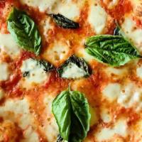 Margherita Pizza · Fresh mozzarella, tomato sauce , basil