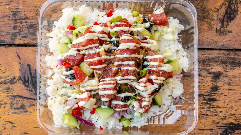 Poke Bowl · Ahi Poke served over diced veggies and rice topped with a drizzle of our Wasabi Aioli
