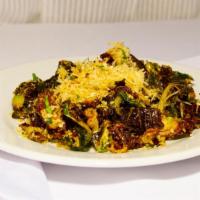 Crispy Brussels · Pancetta, Romano cheese, toasted bread crumb.