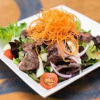 Grilled Beef Salad · Grilled beef sirloin and mesclun mixed with red onion, tomatoes, cucumbers and basil in spic...