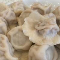 Dumplings · 12 pieces. option: pork with Chinese cabbage or Chinese chives.