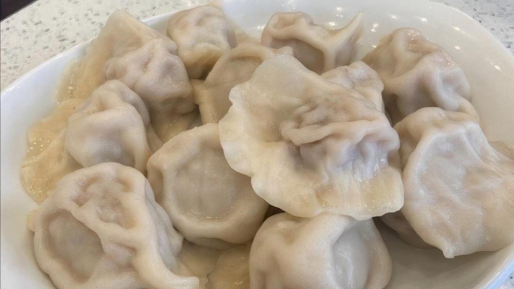 Dumplings · 12 pieces. option: pork with Chinese cabbage or Chinese chives.