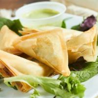 Samosas · Fried pastry with peas and spices and a choice of seasoned beef or potato filling. Served wi...