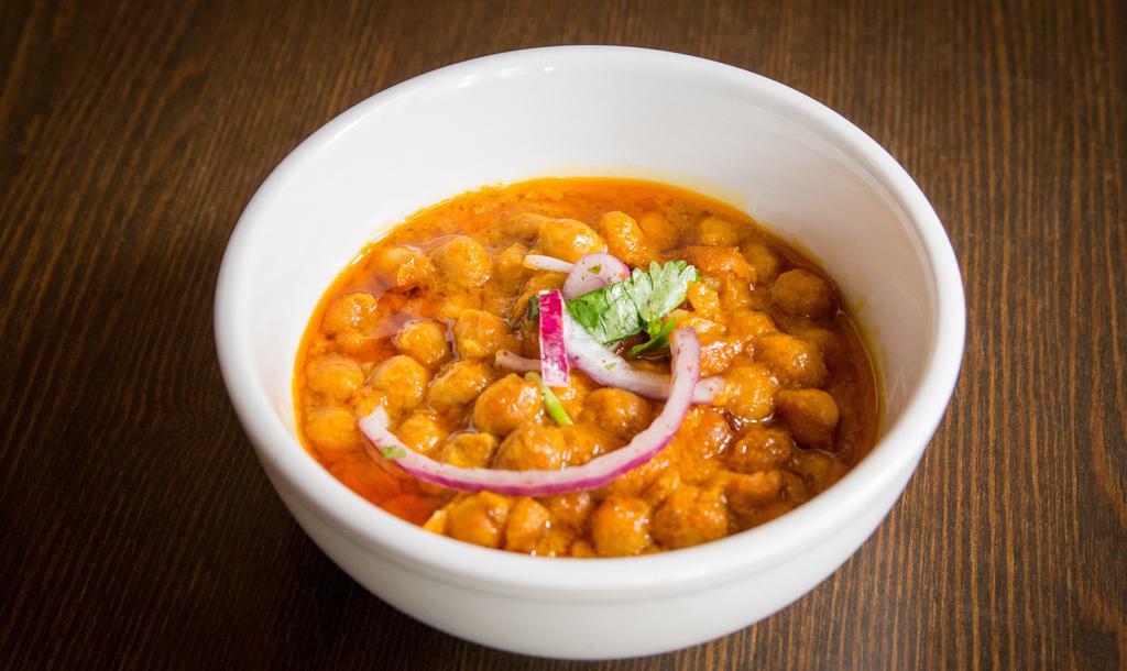 Chickpea Curry · Garbanzo beans cooked in Afghan spices and fresh tomato sauce.