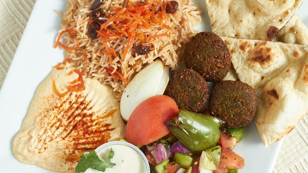 Falafel Platter · Consists of falafel, hummus, Afghan salad, kabuli rice and tandoori naan.