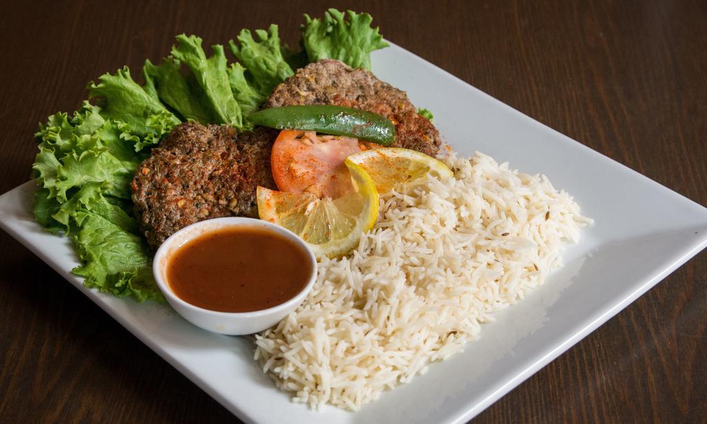 Chapli Kabob · 2 pieces of pan fried ground beef marinated in fresh grated spices. served with Kabuli rice, salad and naan bread.