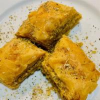 Baklava · Layer of thin pasty with walnuts, almonds and pistachios with honey caramel.