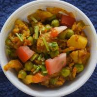Aloo Gobi Masala · Vegan. Potatoes and cauliflower sautéed with ginger, tomato, and spices.