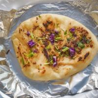 Butter Naan · Simple but delicious unleavened flatbread with butter cooked in clay oven.