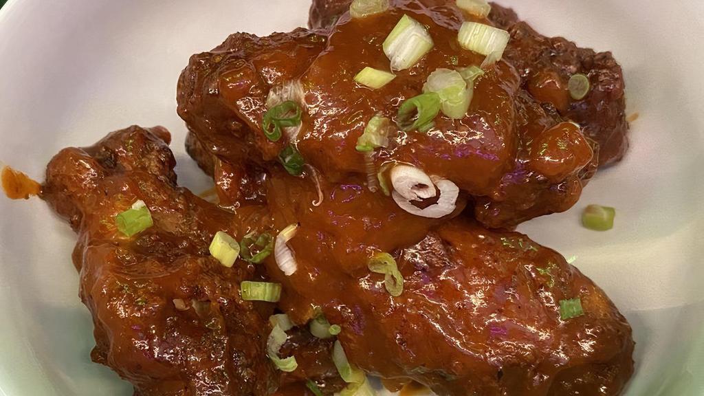 Crispy Chicken Wings · Spicy. Smoked chili pineapple cue sauce.