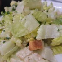 Caesar Salad · The classic. Green salad with Caesar dressing and cheese.