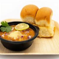 Pav Bhaji · Assorted vegetable bhaji served with toasted pav bread and garnished with onions and cilantro