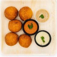 Mysore Bonda · Tasty & delicious deep fried south Indian dumplings made w/ battered flour, served with 3 ch...
