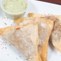 Sambosay Goshtee · Fried pastry, stuffed with ground beef, chickpeas and herbs