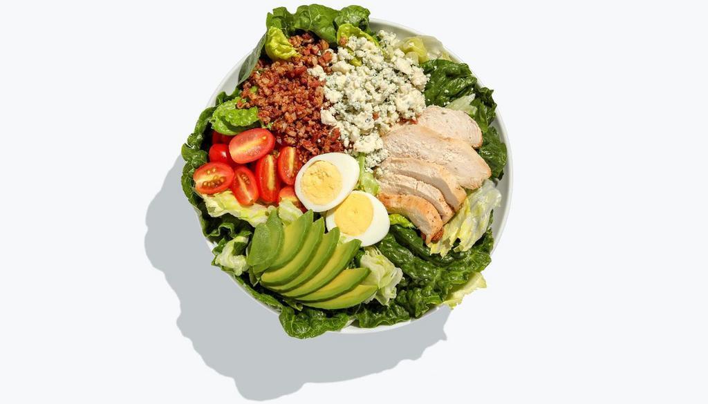 What About Cobb Salad · Romaine, iceberg, garlic roasted chicken, bacon, boiled egg, cherry tomatoes, avocado, bleu cheese crumbles, topped with croutons, and served with Balsamic Vinaigrette dressing.