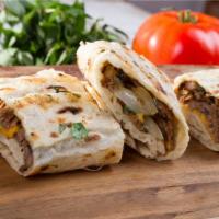 Lamb Gyro Pita Wrap · Thinly sliced, marinated and spit-roasted lamb, served in a soft pita with charred carrot hu...
