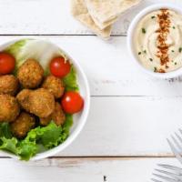 Broken Falafel Bowl · Our creamy, classic hummus with our housemade, crispy fried falafel, served on a bed of fres...