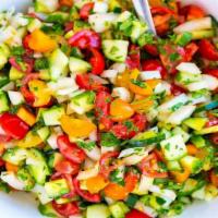 Cucumber Tomato Salad · Fresh cucumbers, tomatoes, red onions and aromatic basil with crumbled feta and balsamic vin...