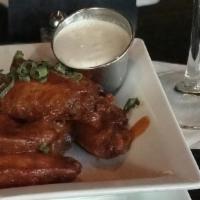 Spicy Buffalo Wings · Blue Cheese or Ranch Dressing