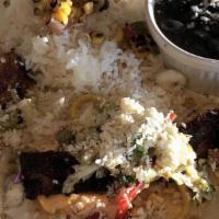 Mahi Mahi Tacos · Black Beans, Rice, Fresh Vegetable Slaw