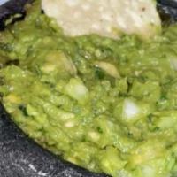Guacamole · Gluten free, spicy. Hass avocados, onions, cilantro, jalapeños, and lime served with warm to...