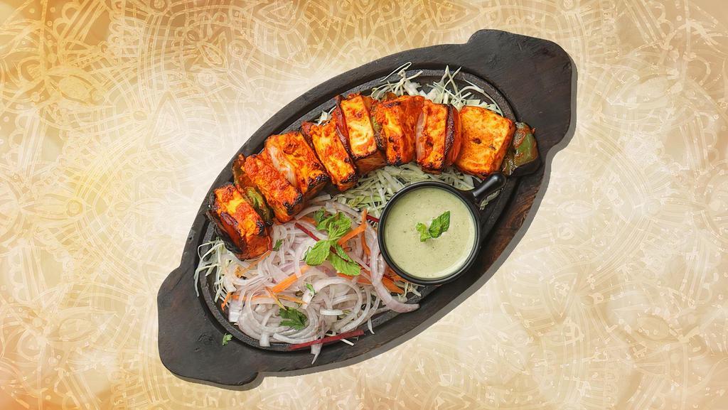 Country Cheese Tikka · Chunks of paneer marinated in spices and grilled.