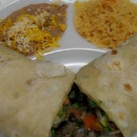 Carne Asada Burrito · Carne Asada Burrito: steak, guacamole, pico, rice & beans inside.