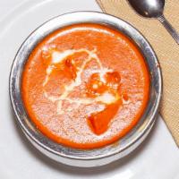 Chicken Tikka Masala · Tender boneless chicken grilled in tandoor cooked tomato cream sauce with imported seasonings.