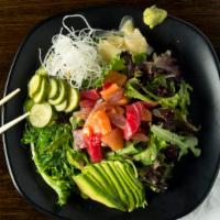 Spicy Seafood Salad · Diced assorted fish, organic spring mix, avocado, seaweed salad and cucumber salad with spic...