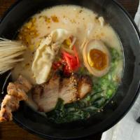 Special Tonkotsu Ramen · Soy glazed egg, pork belly, pork dumpling, chicken yakitori, black garlic oil and standard t...