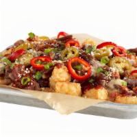 Dirty Dubs Tots · TOTS / SMOKED PULLED BRISKET / GRILLED ONIONS / HATCH QUESO / SWEET BBQ / PICKLED HOT PEPPER...