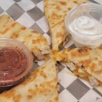 Chicken Quesadilla · Grilled chicken and cheese inside a grilled flour tortilla. Served with sour cream and salsa.