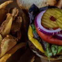 The Shillelagh Burger · All-beef patty, American cheese, lettuce, tomato, red onion, and pickle chips. Served on a K...