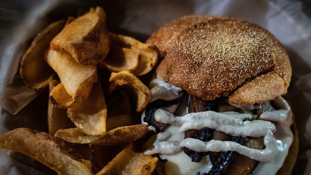 Mushroom Smoked Gouda Burger · Beyond Burger patty, sautéed Portobello mushrooms, Vegan Caesar dressing, and Vegan Smoked Gouda cheese. Served with French fries.