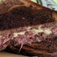 Corned Beef & Swiss · Corned beef and Swiss cheese on grilled rye. Served with a kettle chips.