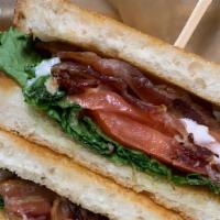 Blt · Bacon, lettuce, tomato, mayo, served on grilled sourdough, served with kettle chips.