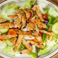 Grilled Chicken Salad · Our garden salad topped with our famous marinated chicken breast grilled to perfection.