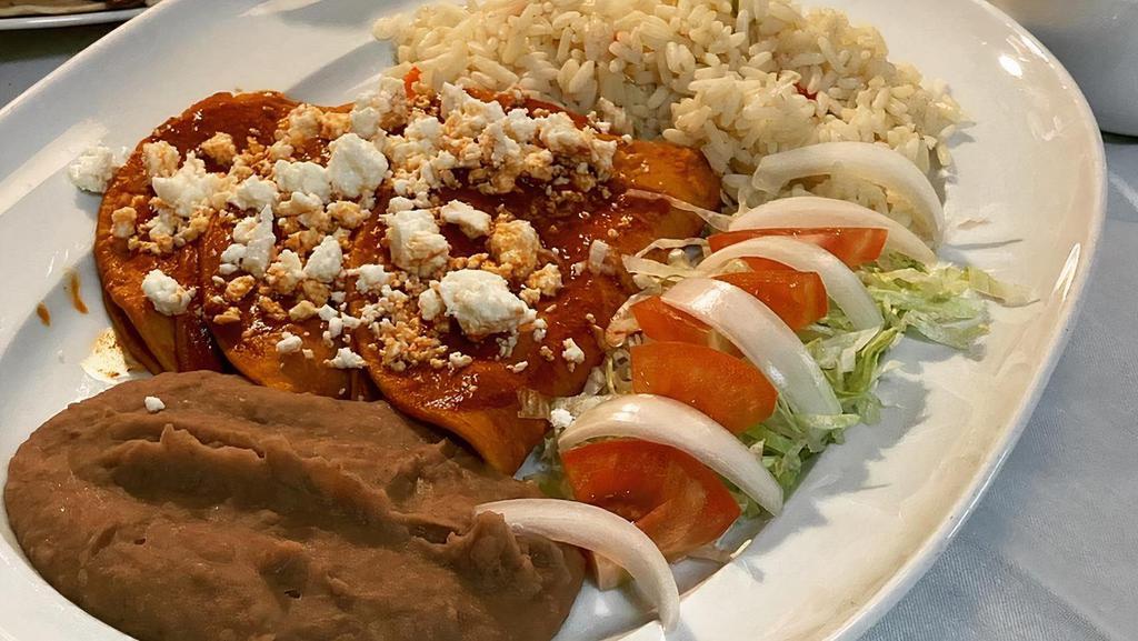 Red Enchiladas (Guajillo Enchiladas) · 3 Red Enchiladas with red guajillo sauce comes with Mexican rice ,refried beans and queso fresco and  green salad.