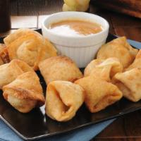 Crab Rangoon · Crab and cream cheese wontons pinched into little purses and deep fried. Served with sweet a...