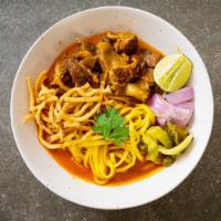 Noodles In Red Curry · Medium spicy. Thin rice noodle, string bean, eggplant, bamboo shoots, bell peppers and basil...