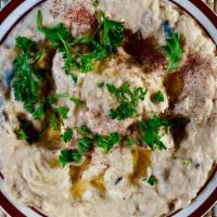 Babaghanooj · Dip. Smoked and roasted eggplant mixed with tahini, garlic, and lemon topped with olive oil ...