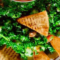Tabouli Salad · Most Popular. Tossed fresh parsley, green onions, tomatoes, cucumbers, bulgar wheat topped w...