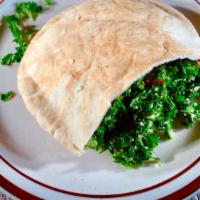 Kofta Kabob Sandwich · Served in pocket pita bread stuffed with tahini, tabouli, and Turkish salad with red and gre...