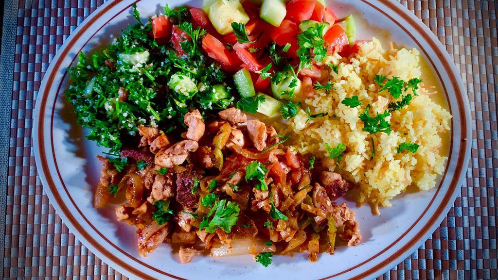 #13 Lamb & Chicken Special · Mixed pieces of chicken & lamb sauteed with onions & fresh tomatoes seasoned with 7 spices, smothered with garlic & lemon. Includes rice, optional House Salad (Tabouli, Mediterranean Salad, Red and Green Pickled Cabbage, Potato Salad and Salsa).